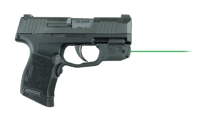 Compact handgun with green laser sight.