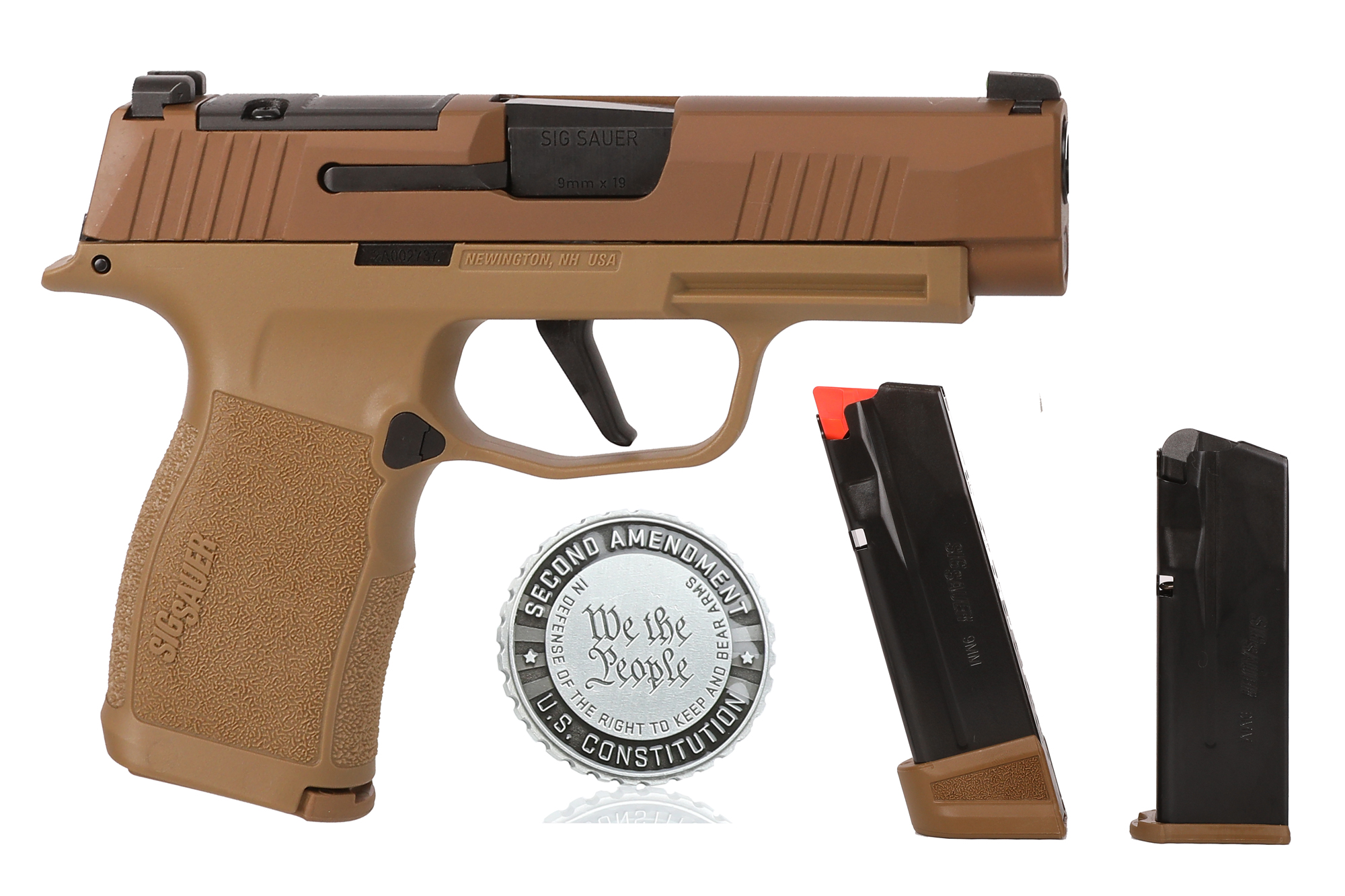 Sig Sauer pistol with magazines and coin.