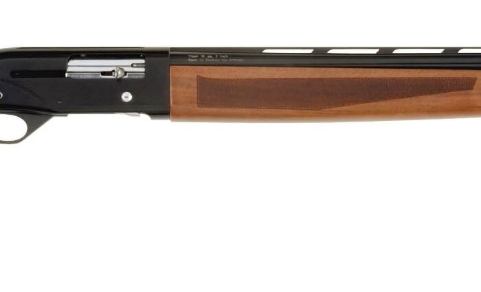 Side view of a shotgun with wooden stock.