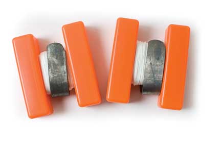 Orange grip tools with white wire spool.