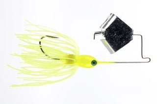 Yellow fishing lure with black weight.