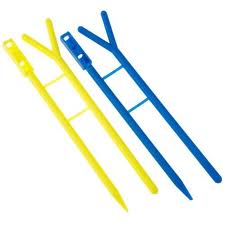 Yellow and blue plastic tent pegs.