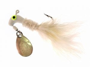 White fishing lure with yellow eyes.