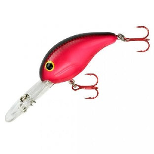 Red fishing lure with treble hooks.